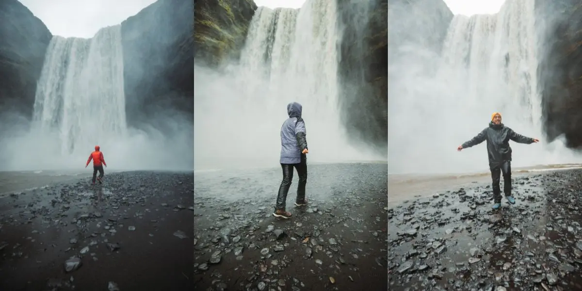 Personas corriendo hacia una cascada en Islandia - Skogafoss